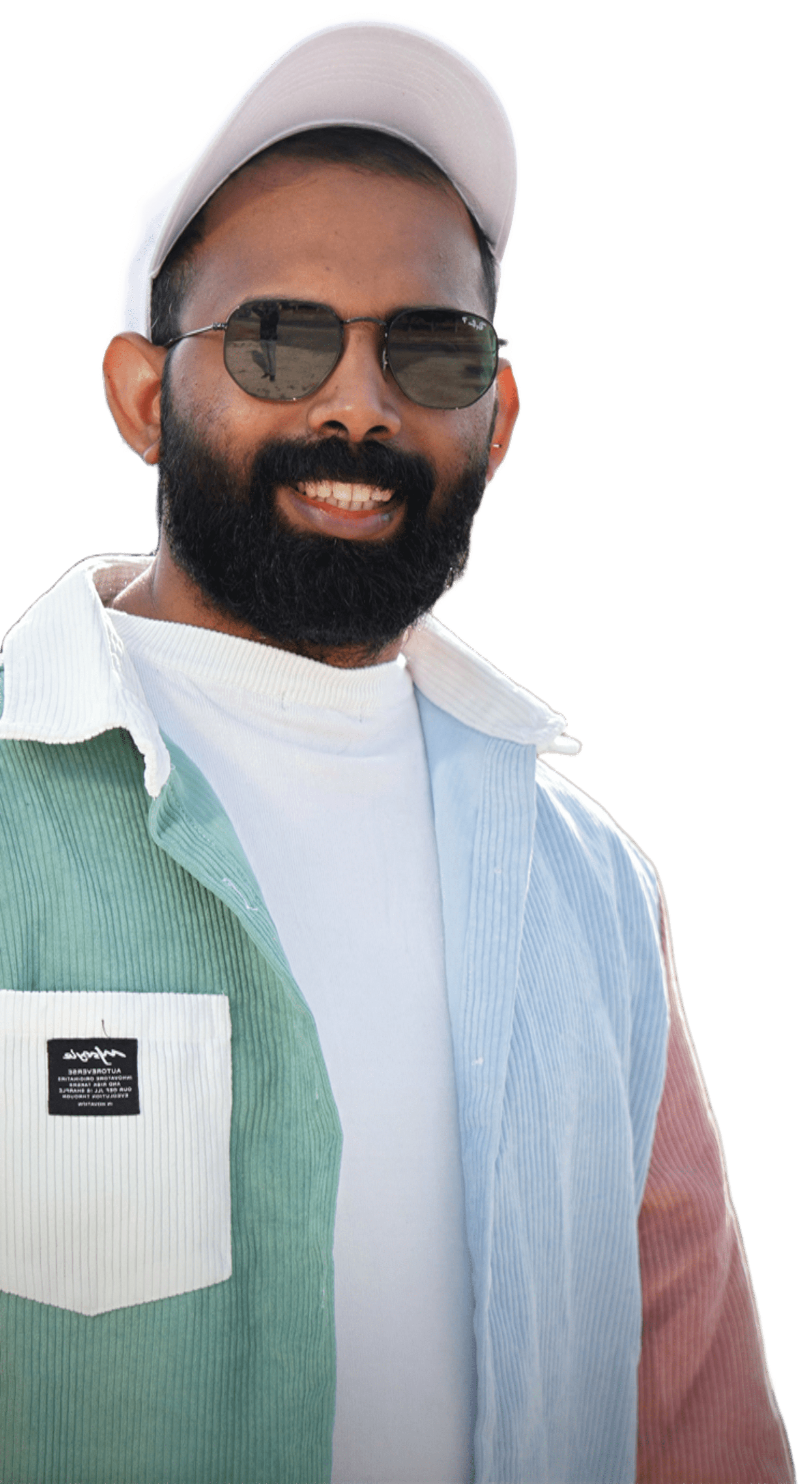 George Joseph smiling in sunglasses and a cap